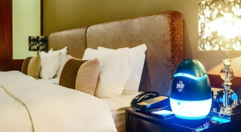 Bed in Eurasia International Hotel