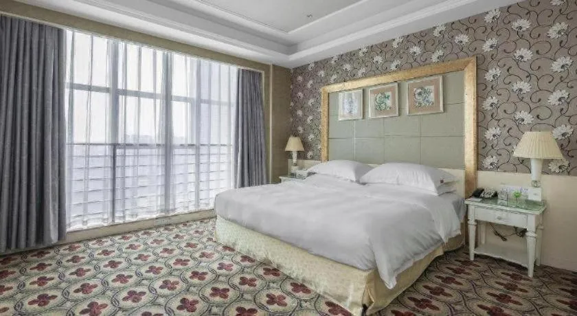 Bed in Eurasia International Hotel