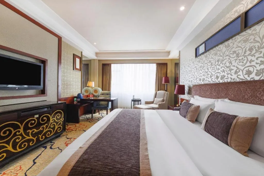 Bed in Eurasia International Hotel