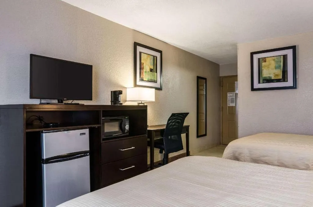 Bed in Quality Inn & Suites