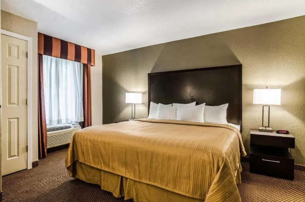 Bed in Quality Inn & Suites
