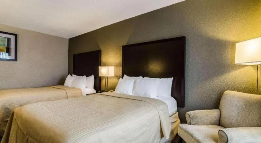 Bed in Quality Inn & Suites