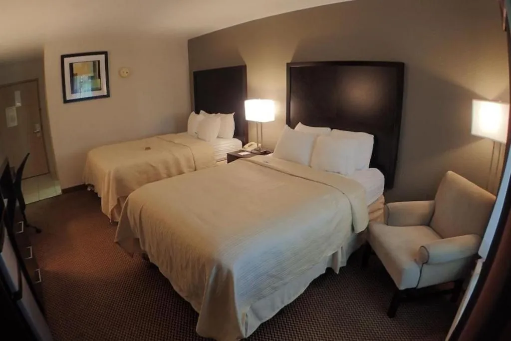 Bed in Quality Inn & Suites