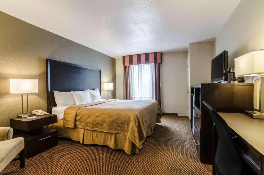 Bed in Quality Inn & Suites