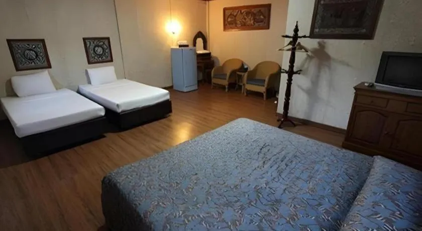 Bed in Chiangsan Goldenland Resort