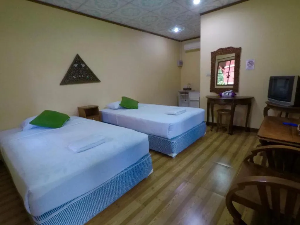 Bed in Chiangsan Goldenland Resort