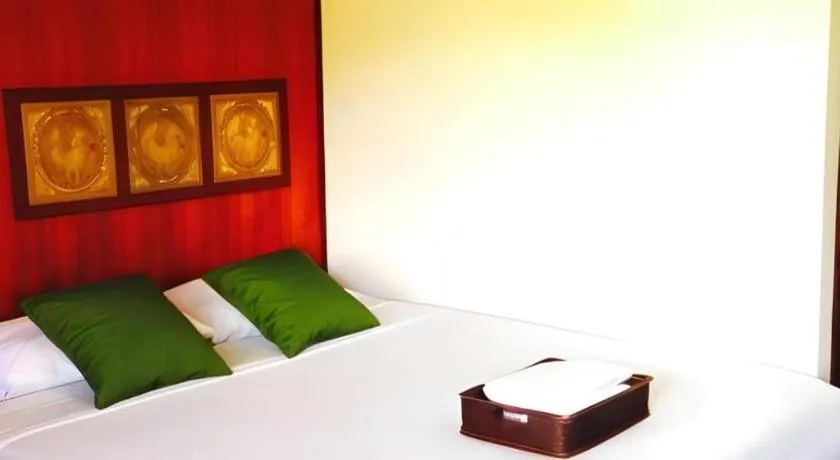 Bed in Chiangsan Goldenland Resort