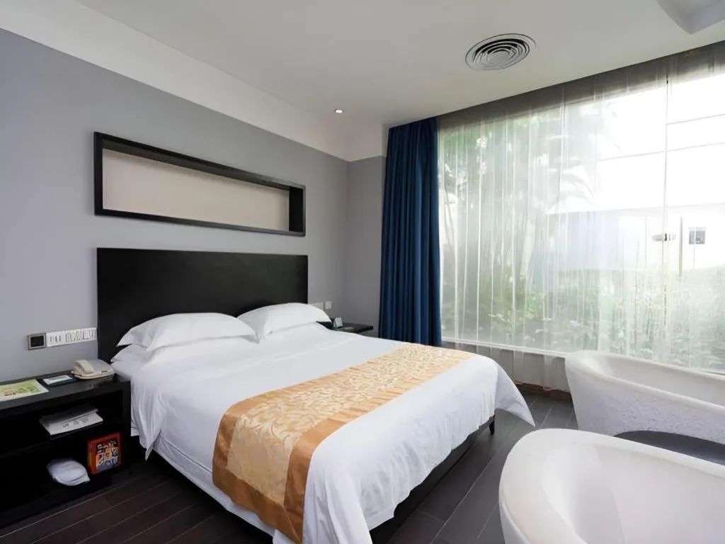 Bed in Guangdong Nanmei Osotto Hotel