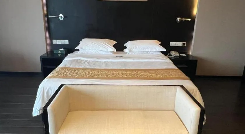 Bed in Guangdong Nanmei Osotto Hotel