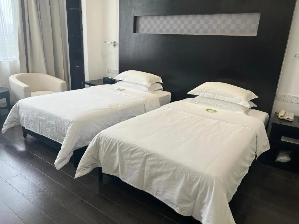 Bed in Guangdong Nanmei Osotto Hotel