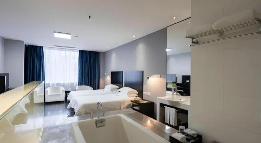 Bed in Guangdong Nanmei Osotto Hotel