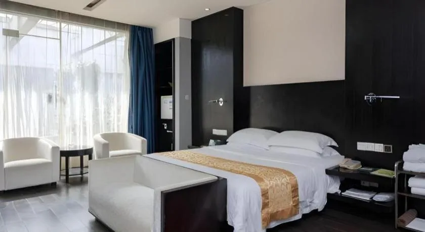 Bed in Guangdong Nanmei Osotto Hotel