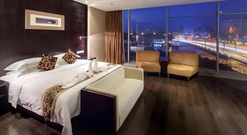 Bed in Guangdong Nanmei Osotto Hotel