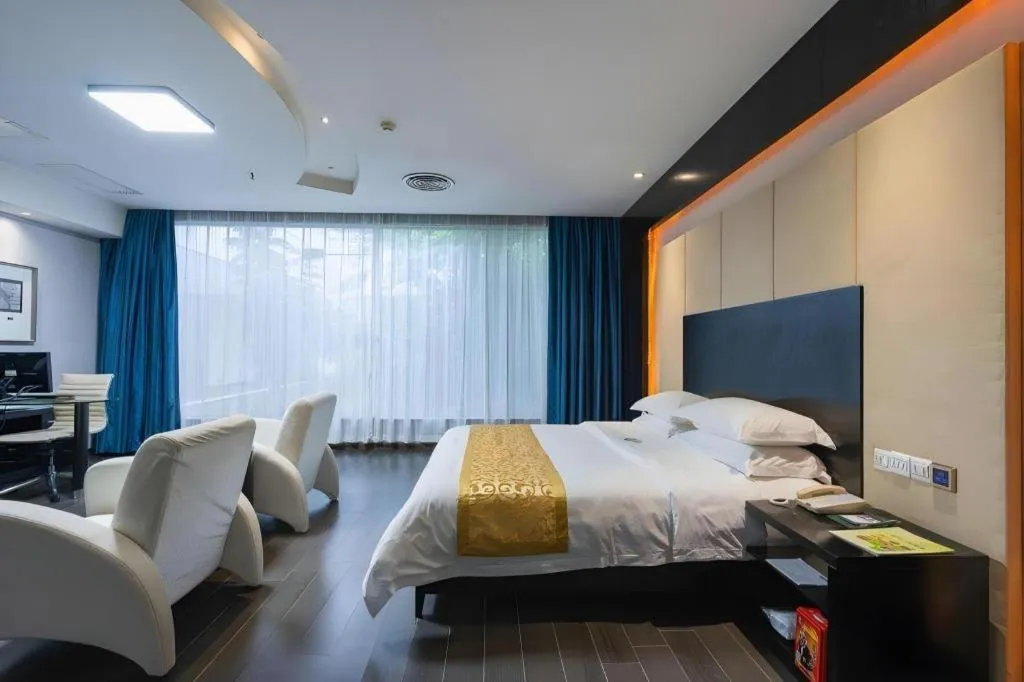 Bed in Guangdong Nanmei Osotto Hotel