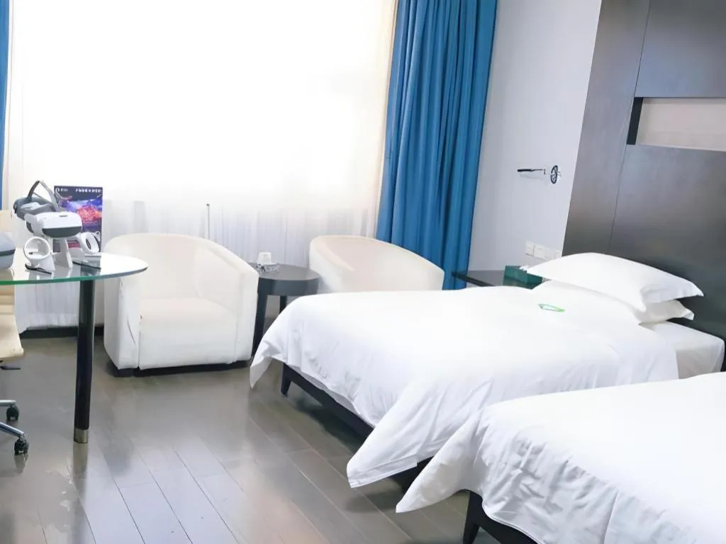 Bed in Guangdong Nanmei Osotto Hotel