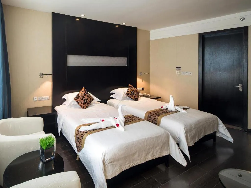 Bed in Guangdong Nanmei Osotto Hotel