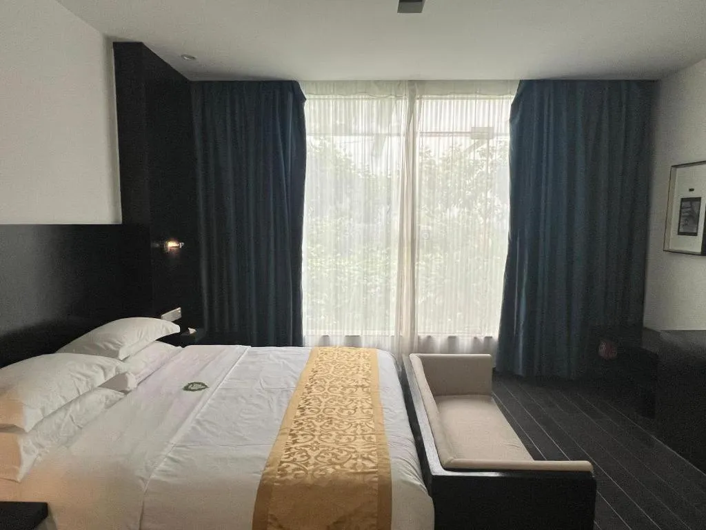 Bed in Guangdong Nanmei Osotto Hotel