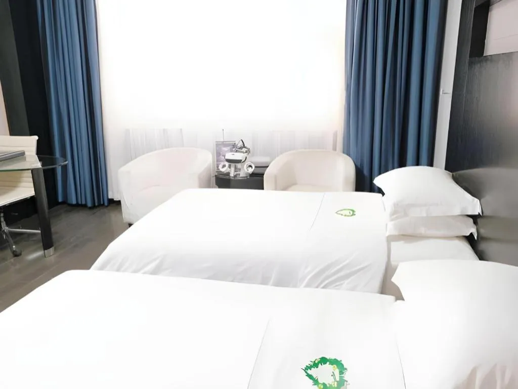 Bed in Guangdong Nanmei Osotto Hotel