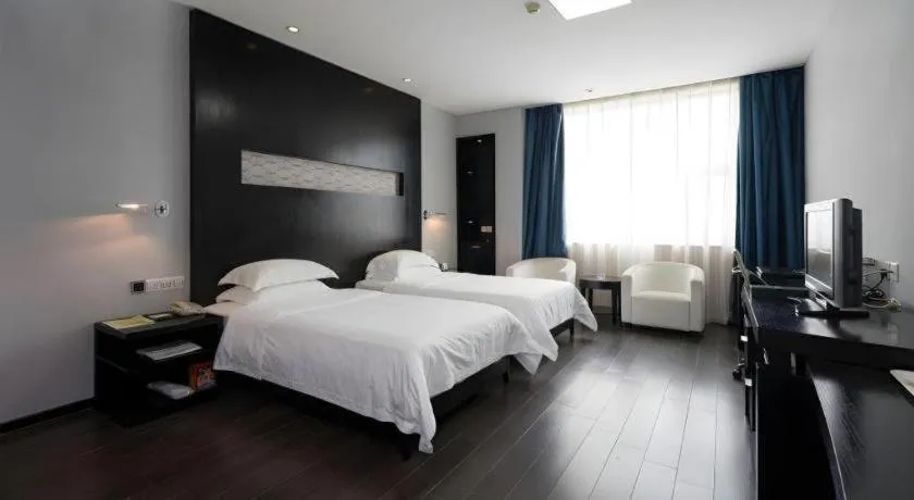 Bed in Guangdong Nanmei Osotto Hotel