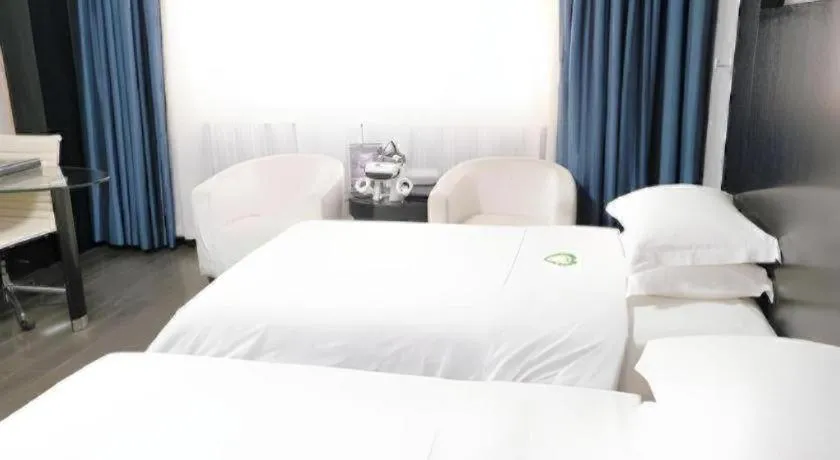 Bed in Guangdong Nanmei Osotto Hotel