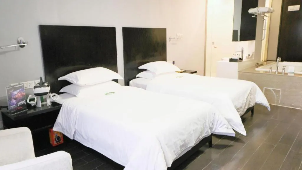 Bed in Guangdong Nanmei Osotto Hotel