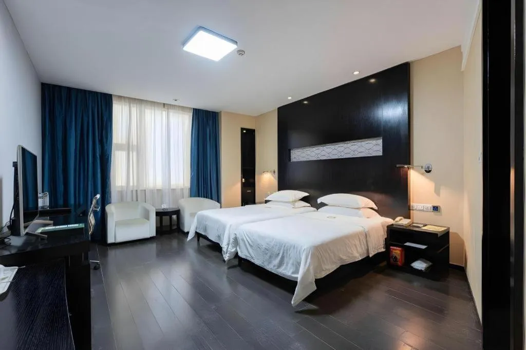 Bed in Guangdong Nanmei Osotto Hotel