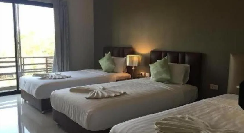 Bed in Villa Thiwa Hotel