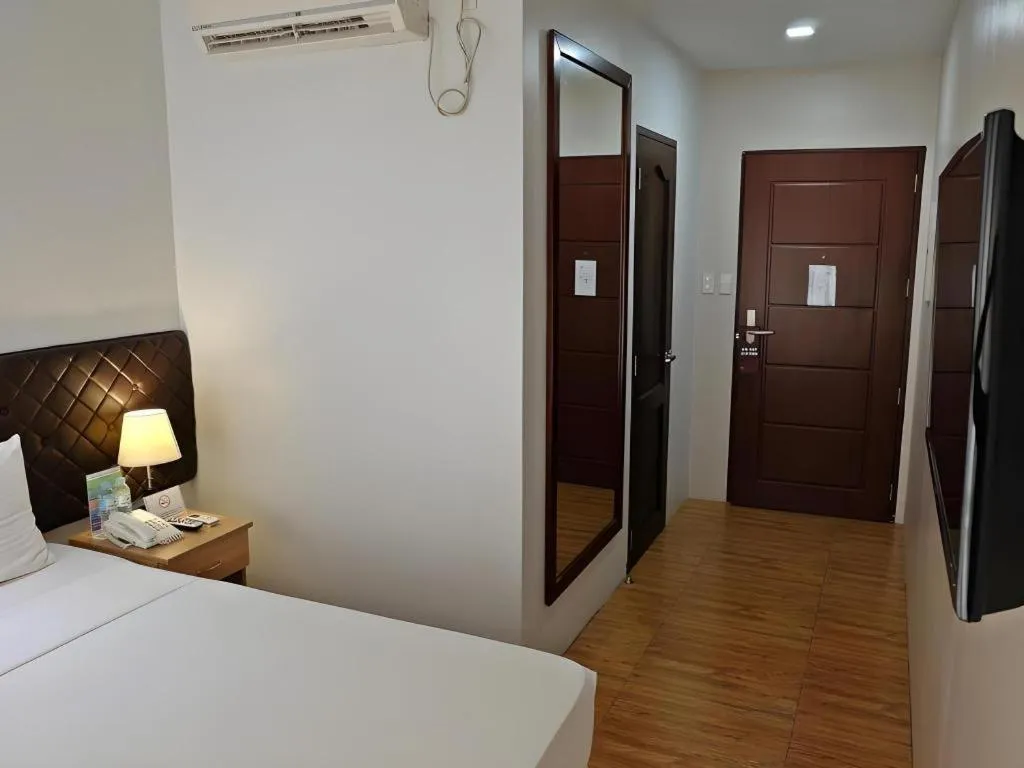 Bed in Capitol Central Hotel and Suites