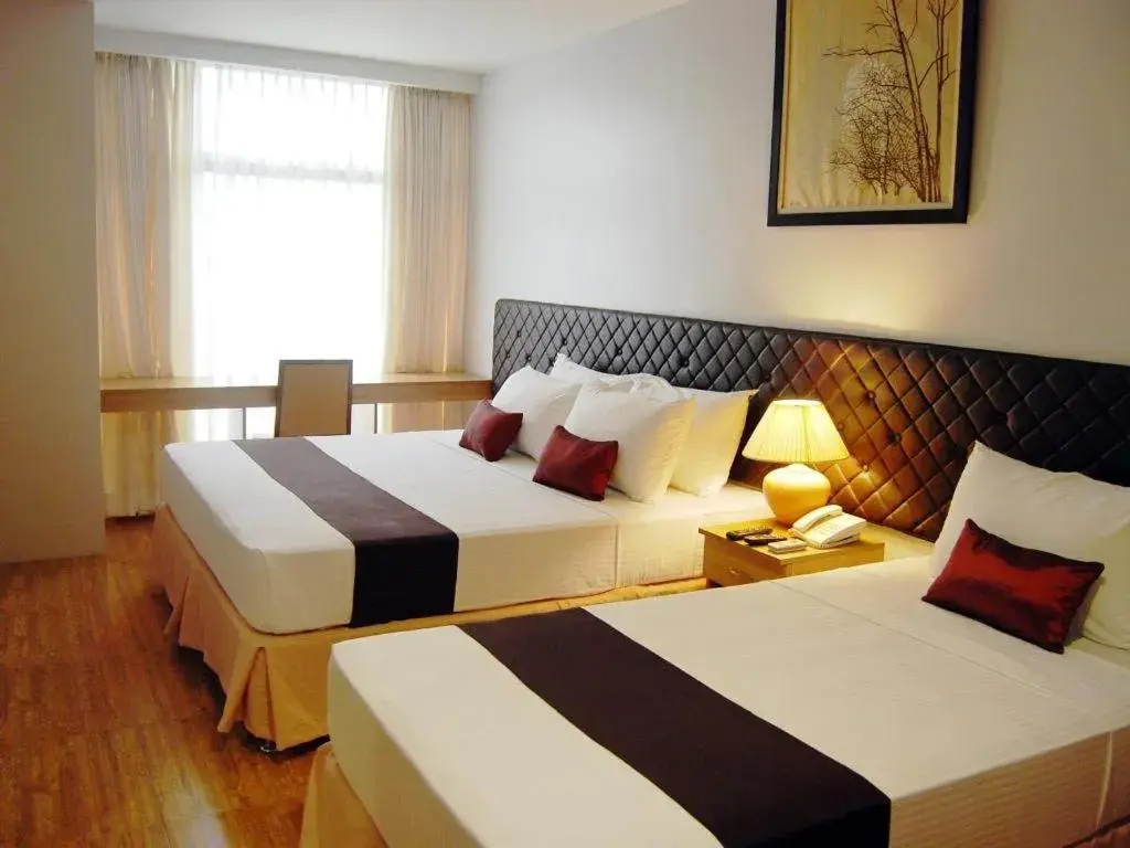 Bed in Capitol Central Hotel and Suites Bed in Capitol Central Hotel and Suites