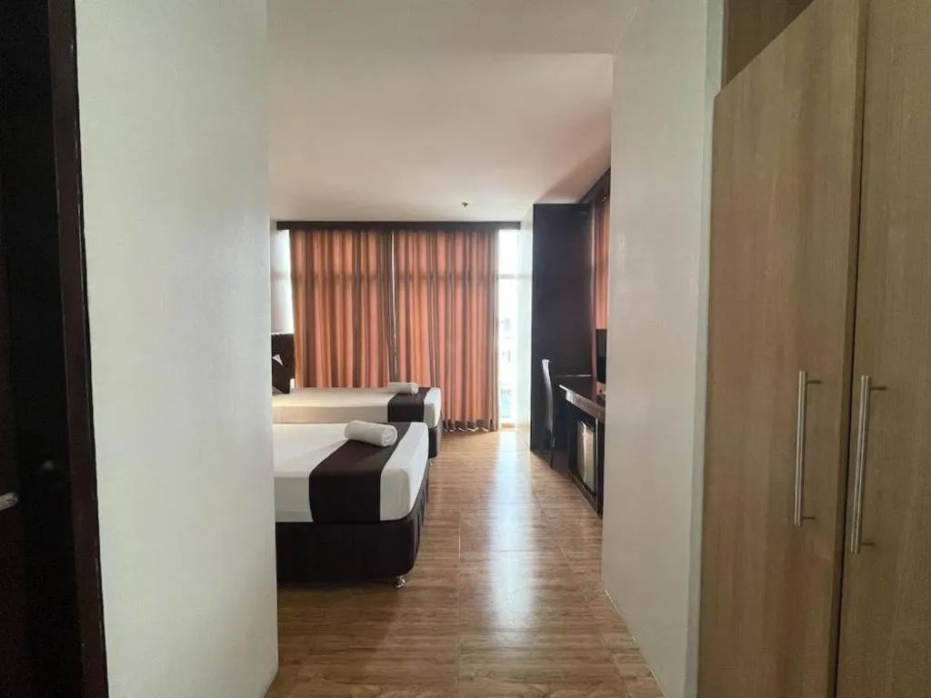 Bed in Capitol Central Hotel and Suites