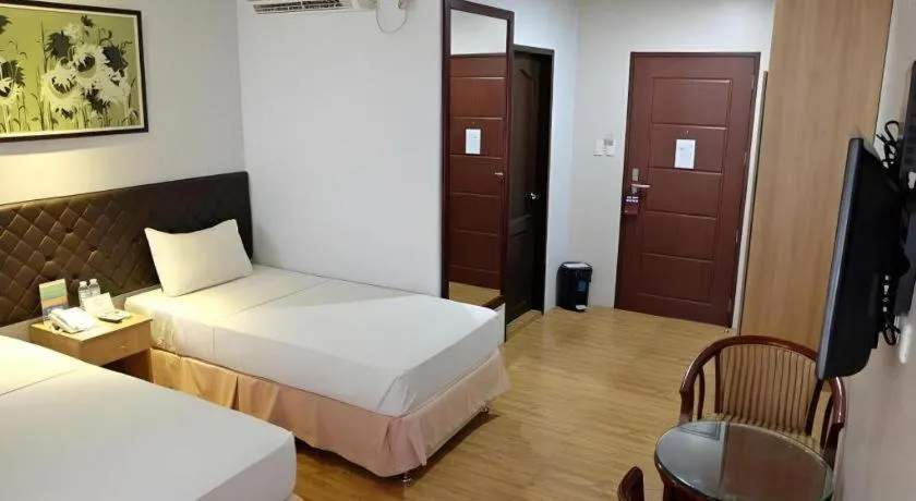 Bed in Capitol Central Hotel and Suites