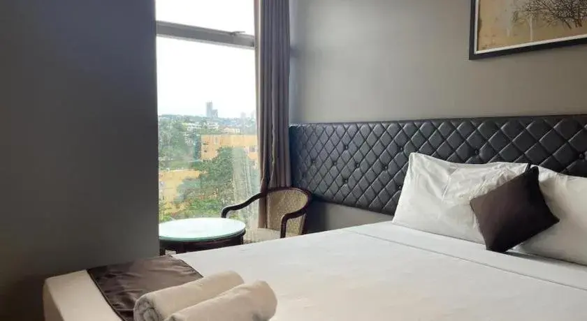 Bed in Capitol Central Hotel and Suites Bed in Capitol Central Hotel and Suites