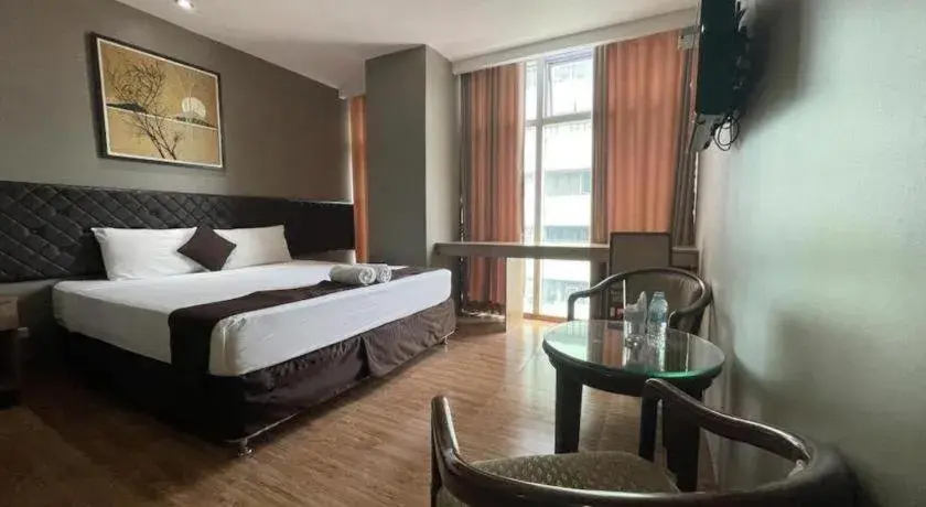 Bed in Capitol Central Hotel and Suites Bed in Capitol Central Hotel and Suites