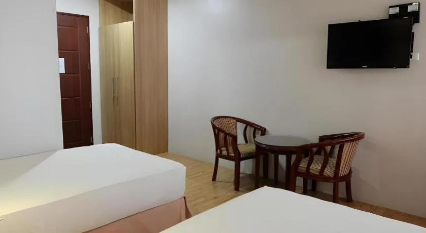 Bed in Capitol Central Hotel and Suites