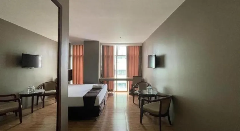 Bed in Capitol Central Hotel and Suites