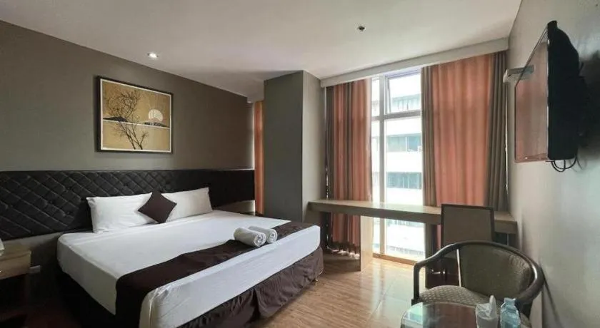 Bed in Capitol Central Hotel and Suites