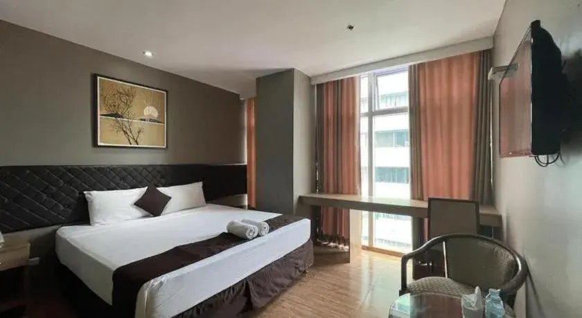 Bed in Capitol Central Hotel and Suites Bed in Capitol Central Hotel and Suites