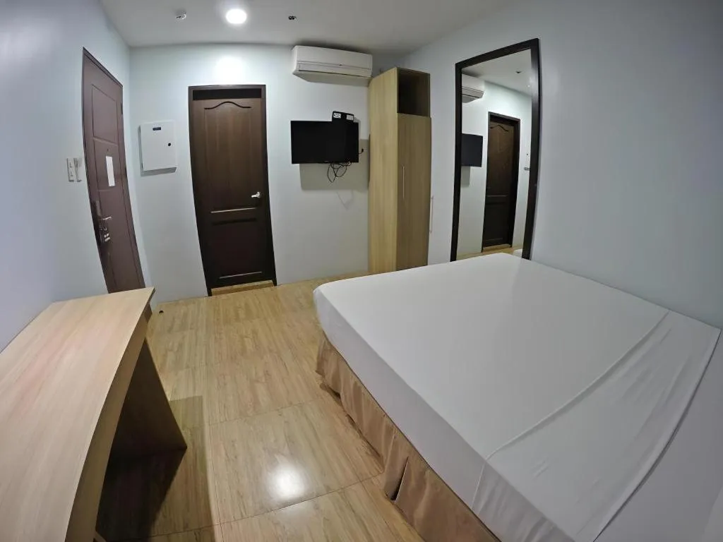 Bed in Capitol Central Hotel and Suites