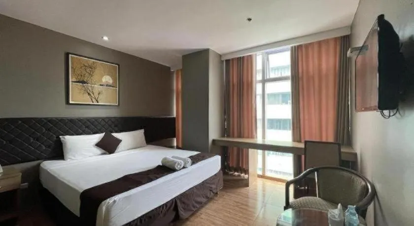 Bed in Capitol Central Hotel and Suites