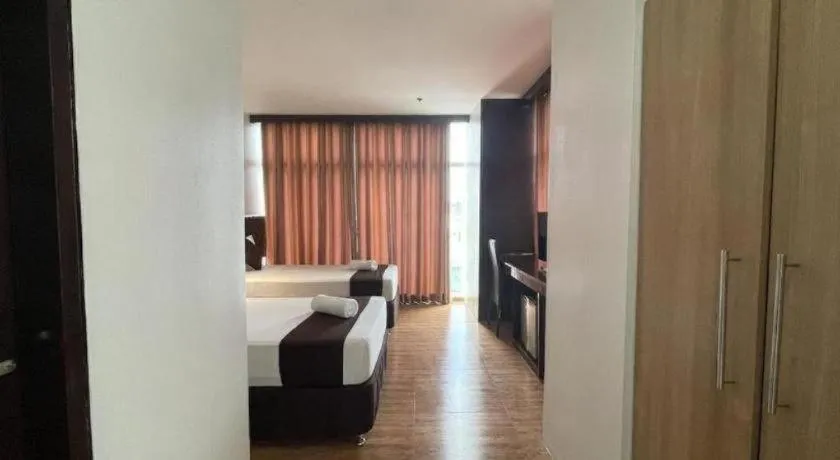 Bed in Capitol Central Hotel and Suites