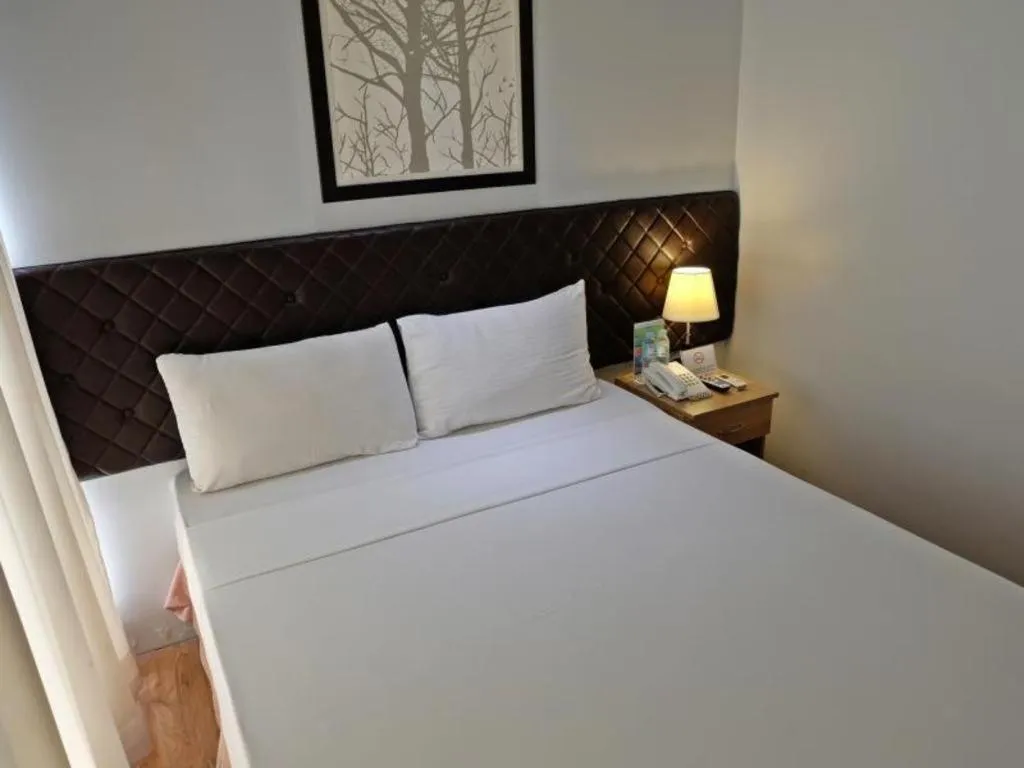 Bed in Capitol Central Hotel and Suites