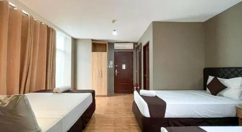 Bed in Capitol Central Hotel and Suites Bed in Capitol Central Hotel and Suites