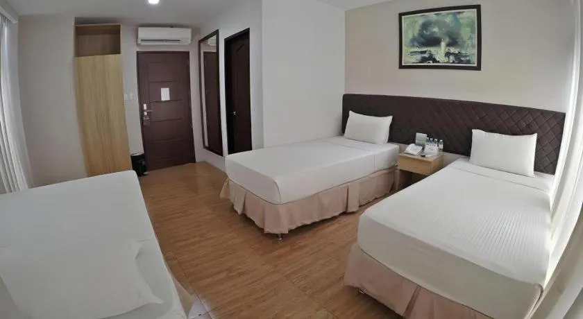 Bed in Capitol Central Hotel and Suites