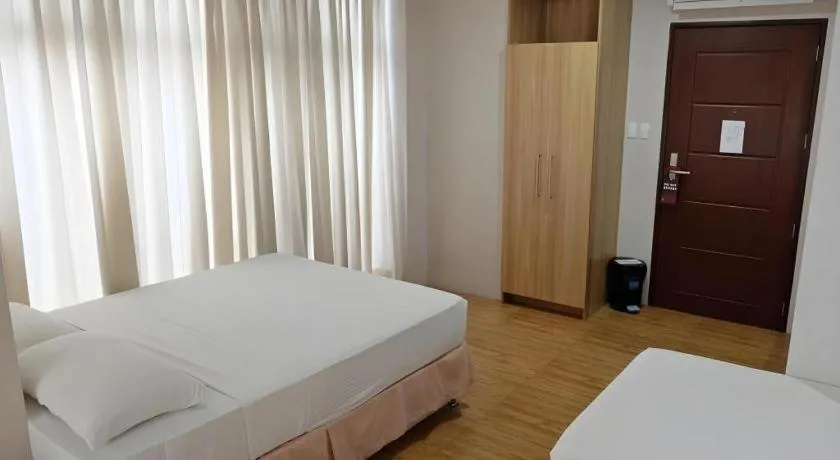 Bed in Capitol Central Hotel and Suites