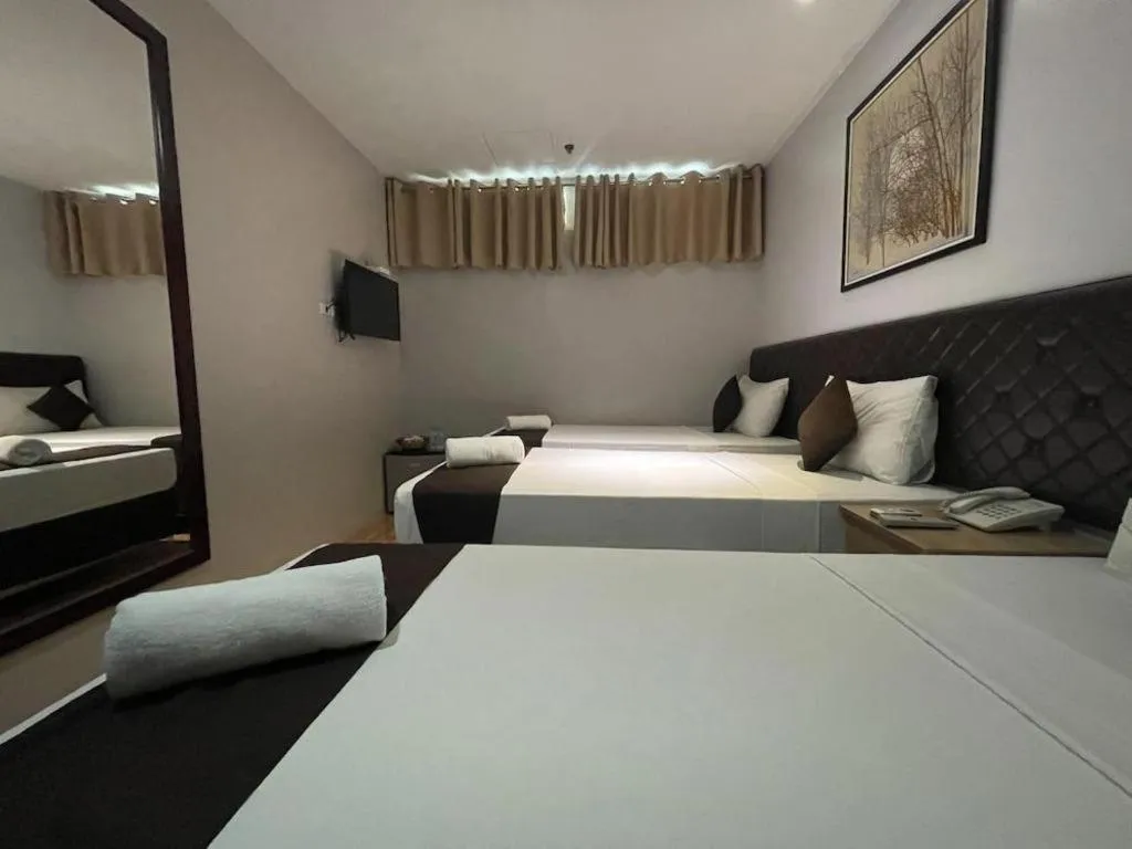 Bed in Capitol Central Hotel and Suites