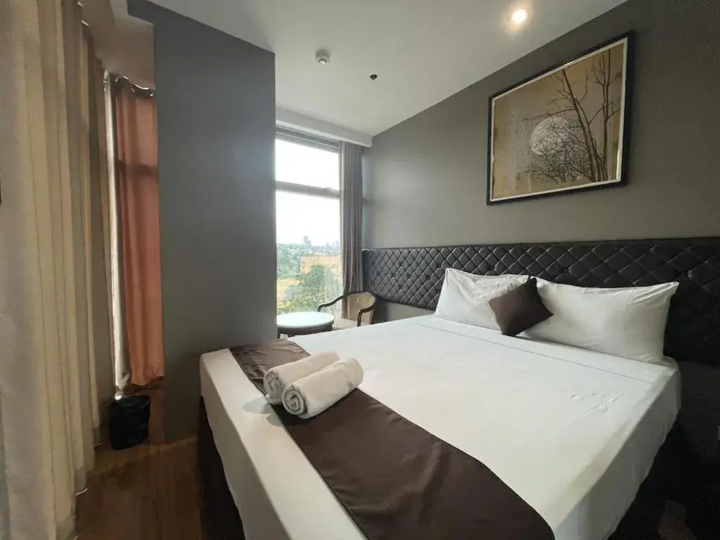 Bed in Capitol Central Hotel and Suites Bed in Capitol Central Hotel and Suites