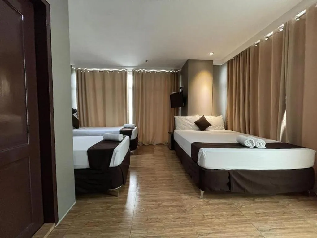 Bed in Capitol Central Hotel and Suites