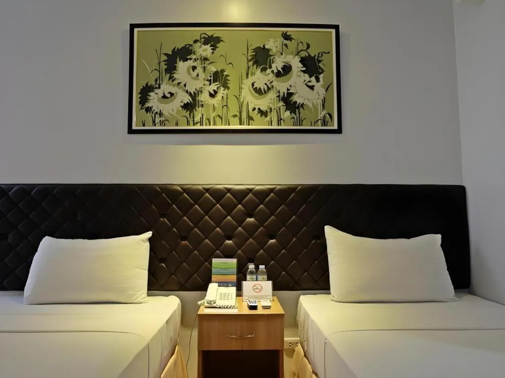 Bed in Capitol Central Hotel and Suites