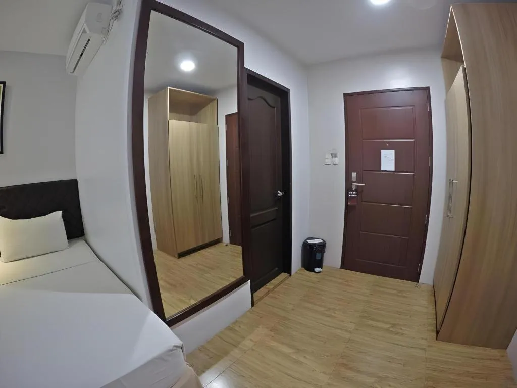 Bed in Capitol Central Hotel and Suites