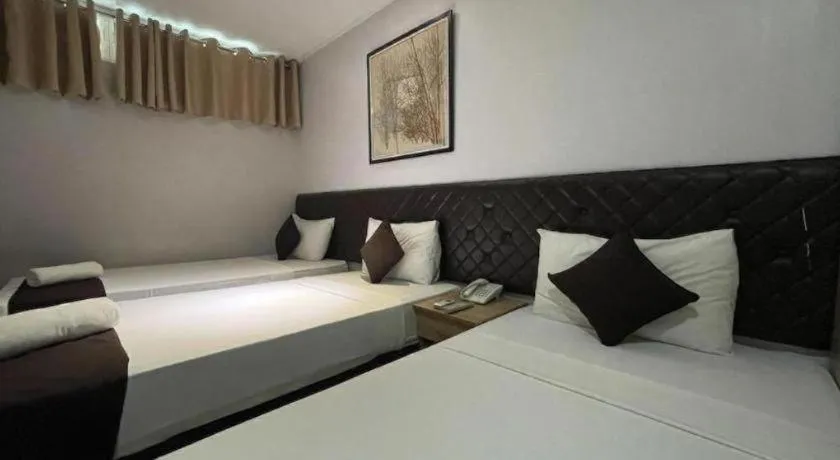 Bed in Capitol Central Hotel and Suites